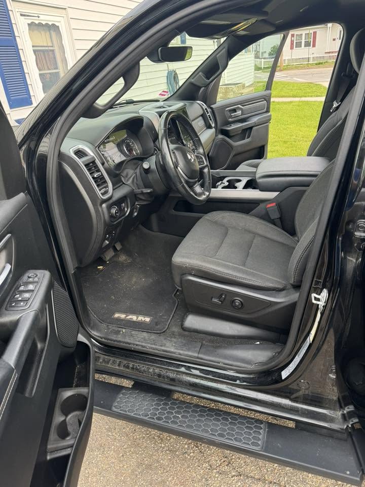 RAM 1500 interior before detail — muddy floor mats and dirty surfaces